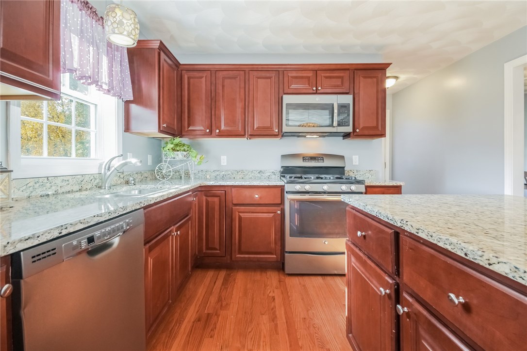 33 Fieldstone Way Westerly, RI 02891 - Photo 10 of 25 Granit countertops, stainless steel appliances and cherry wood cabinets.
