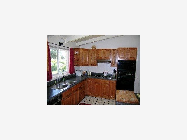 3490 Rio Road Carmel, CA 93923 - Photo 2 of 9 a kitchen with stainless steel appliances a sink and a stove