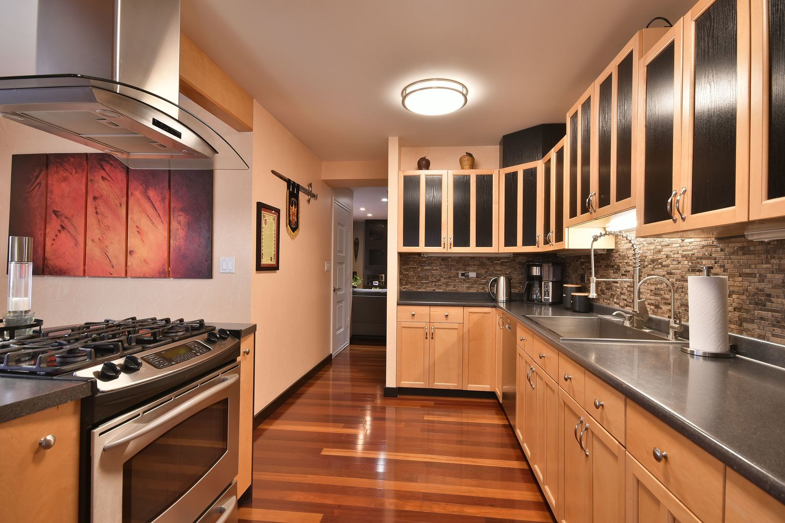 632 Merle Lane Wheeling, IL 60090 - Photo 5 of 46 a kitchen with stainless steel appliances granite countertop a stove and a sink