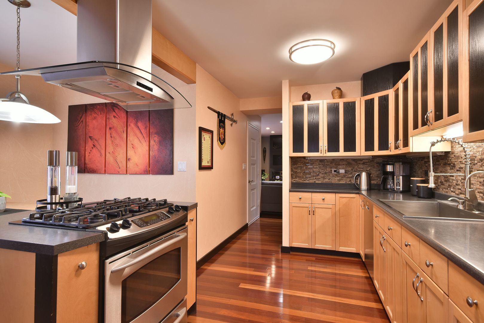 632 Merle Lane Wheeling, IL 60090 - Photo 6 of 46 a kitchen with stainless steel appliances granite countertop a stove and a sink