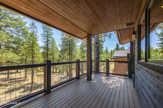 a view of a porch with wooden floor of the house