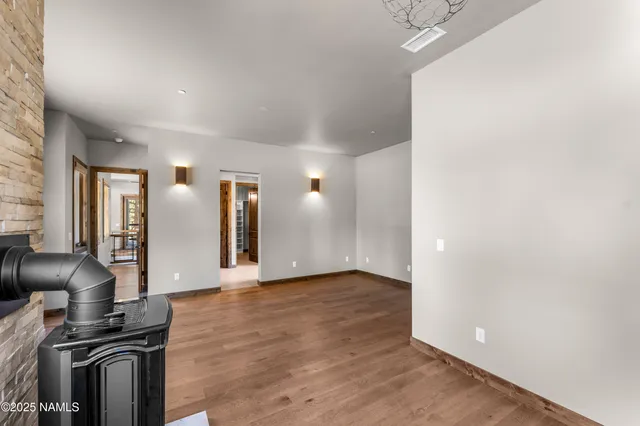 a spacious bathroom with a granite countertop sink and a mirror