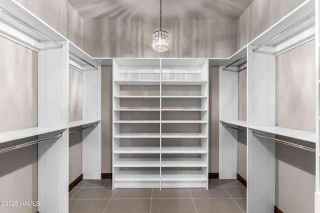 a view of empty room with ceiling fan