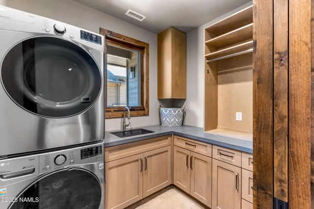 a kitchen with a sink and cabinets