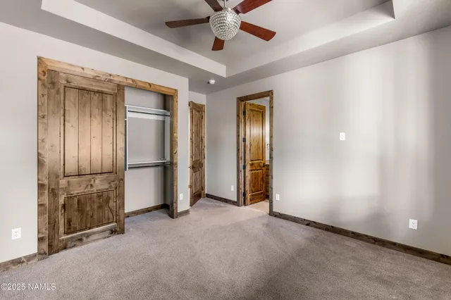 a bathroom with a granite countertop sink a large mirror and a