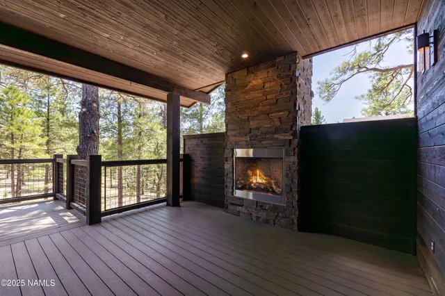 a view of a room with wooden floor and fence
