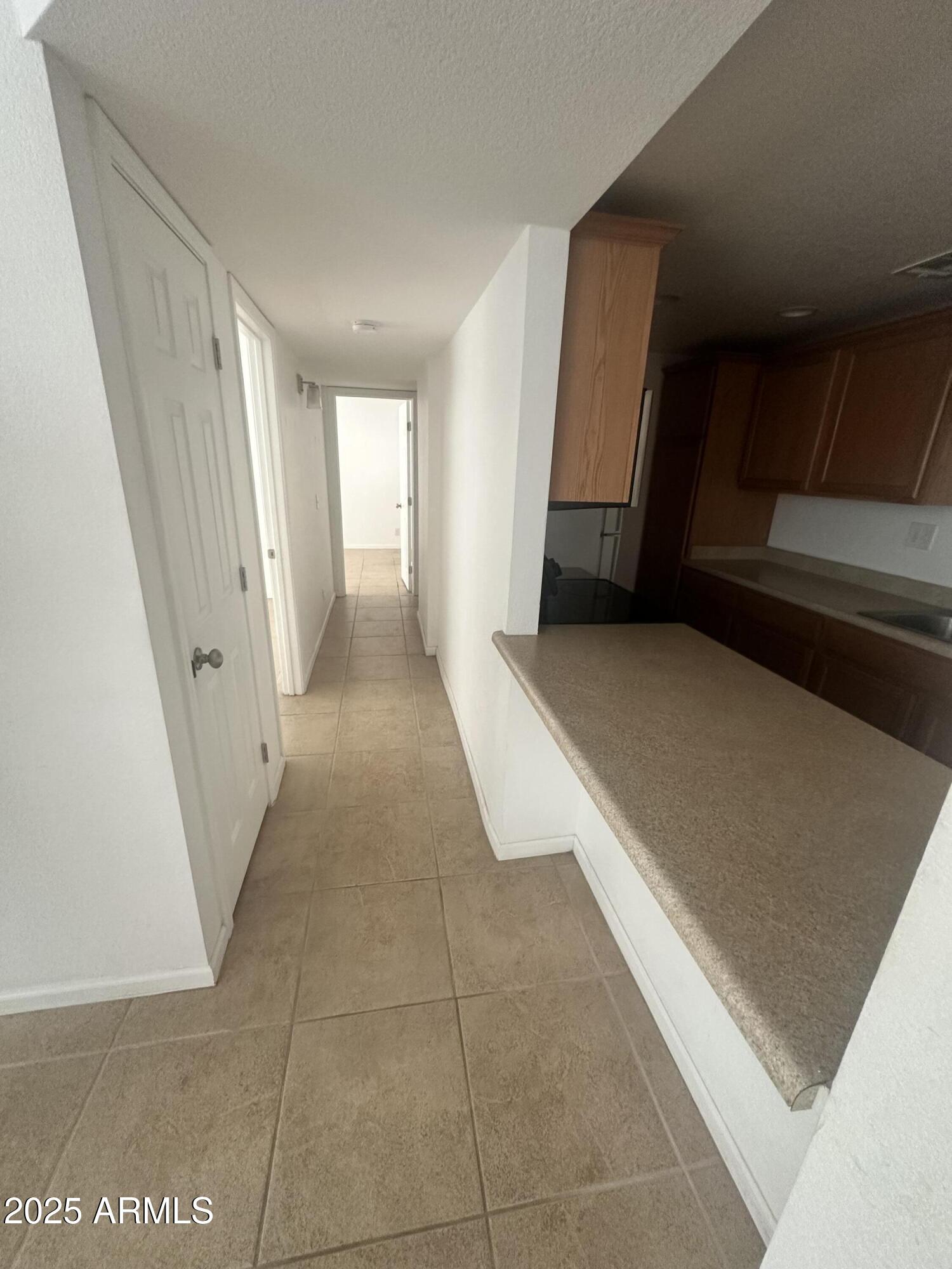 424 West Brown Road, Unit 122 Mesa, AZ 85201 - Photo 5 of 11 a view of a hallway with stairs