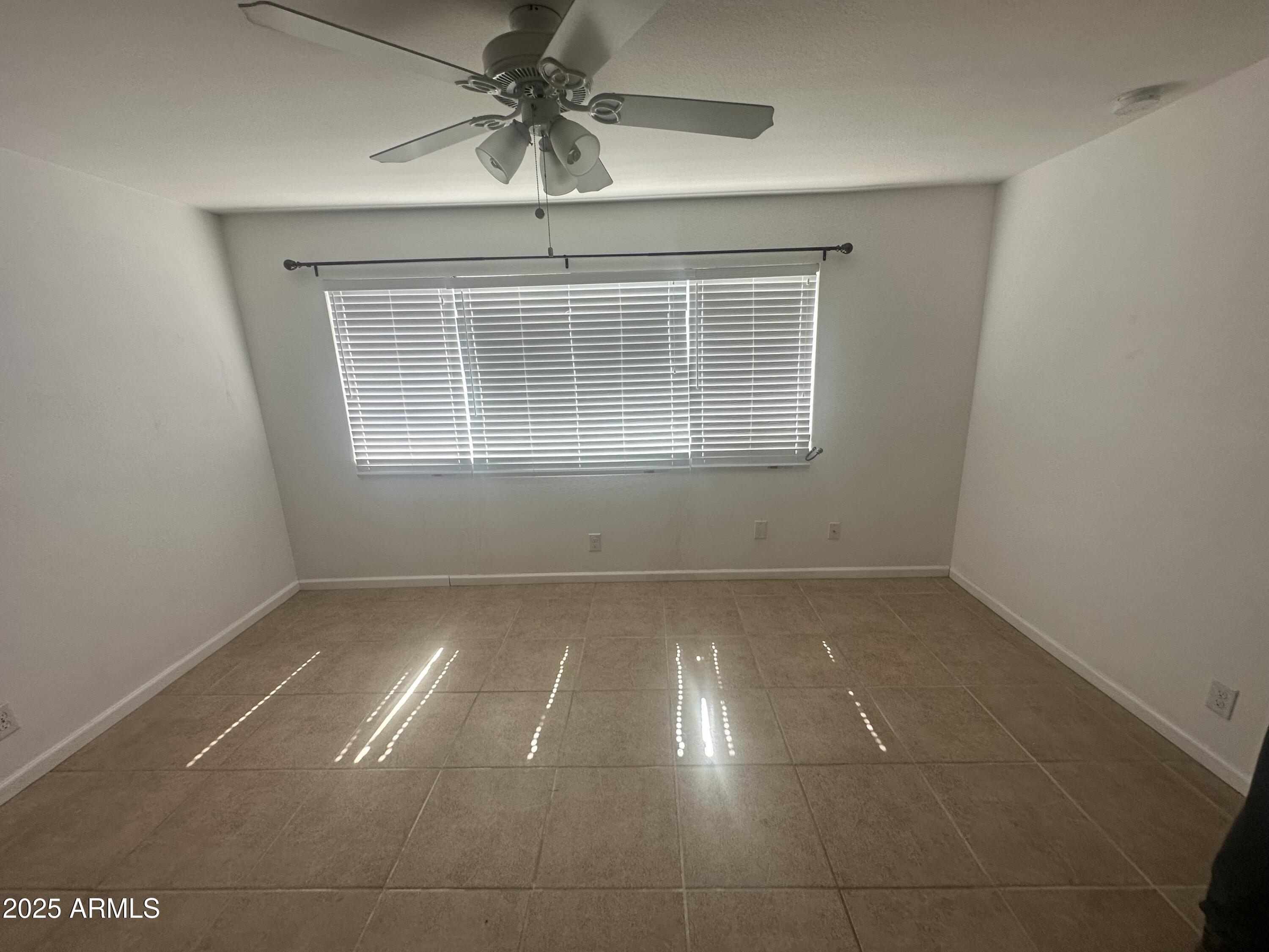 424 West Brown Road, Unit 122 Mesa, AZ 85201 - Photo 6 of 11 a view of an empty room with a window