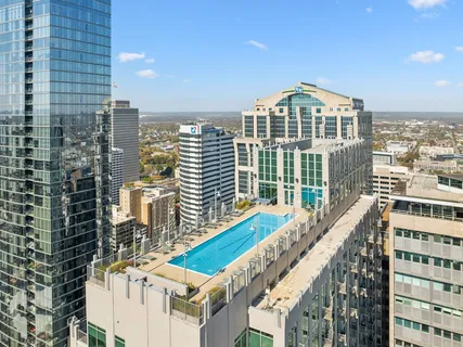 a view of a tall building from a balcony