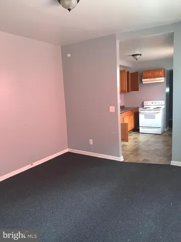 a view of an empty room with stairs