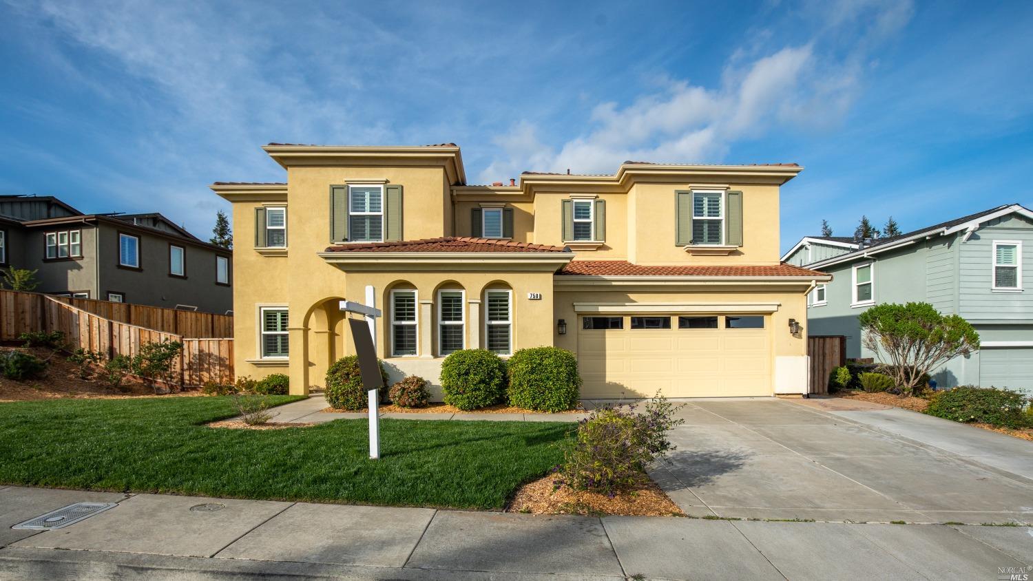 750 Kearney Street Benicia, CA 94510 - Photo 1 of 1 a front view of a house with a yard and garage