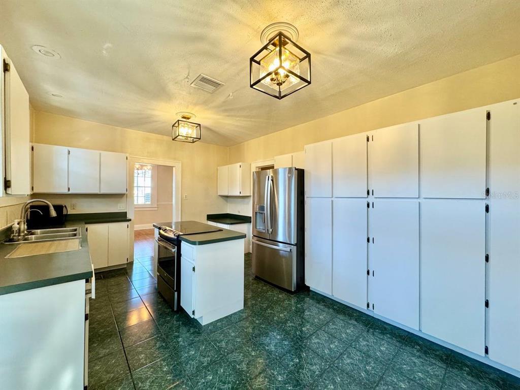 3112 West Palmira Avenue Tampa, FL 33629 - Photo 12 of 37 a kitchen with cabinets and stainless steel appliances