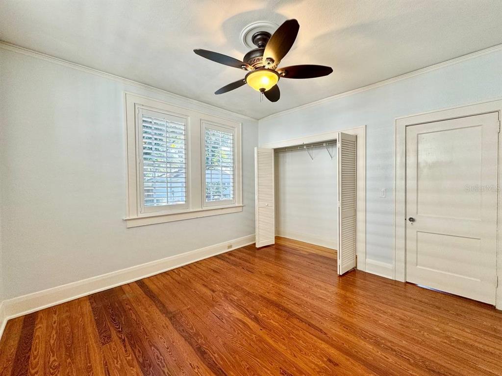 3112 West Palmira Avenue Tampa, FL 33629 - Photo 23 of 37 a view of an empty room with wooden floor and a window