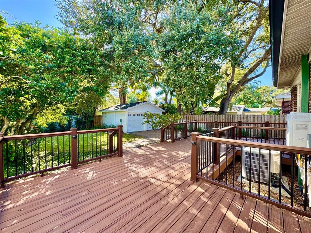 3112 West Palmira Avenue Tampa, FL 33629 - Photo 30 of 37 a view of a deck with wooden floor and outdoor seating