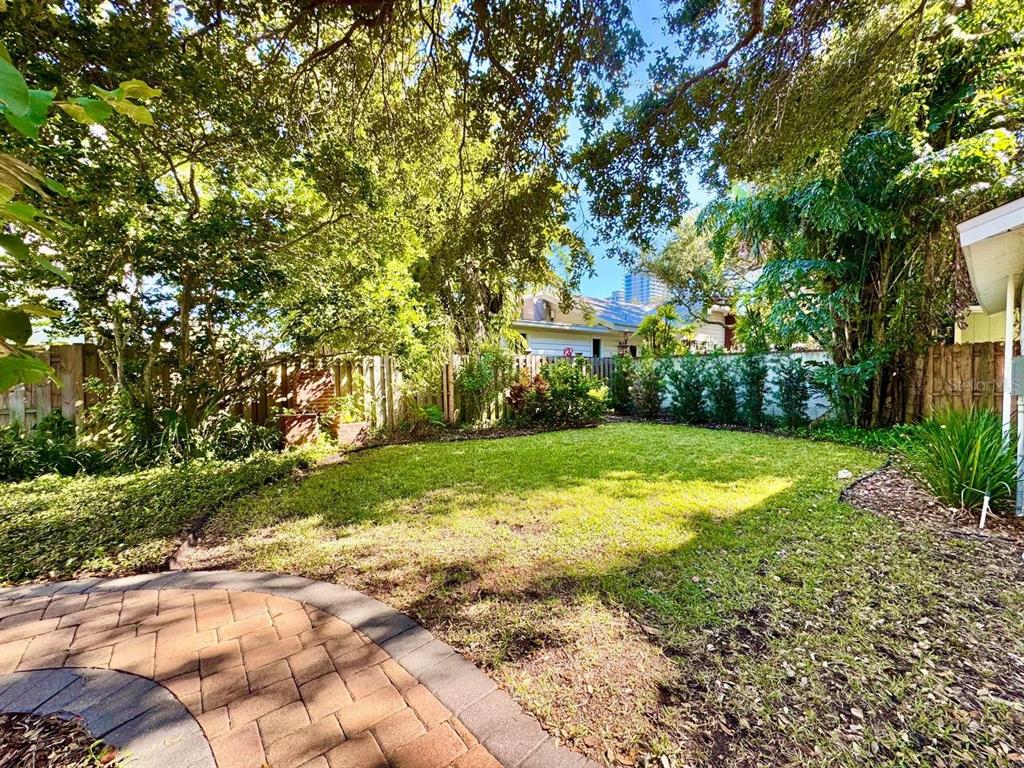 3112 West Palmira Avenue Tampa, FL 33629 - Photo 32 of 37 a view of yard with swimming pool and green space