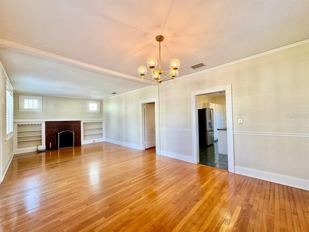 3112 West Palmira Avenue Tampa, FL 33629 - Photo 5 of 37 wooden floor fireplace and windows in an empty room