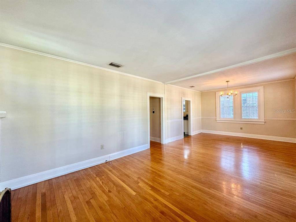 3112 West Palmira Avenue Tampa, FL 33629 - Photo 8 of 37 a view of a big room with wooden floor and windows