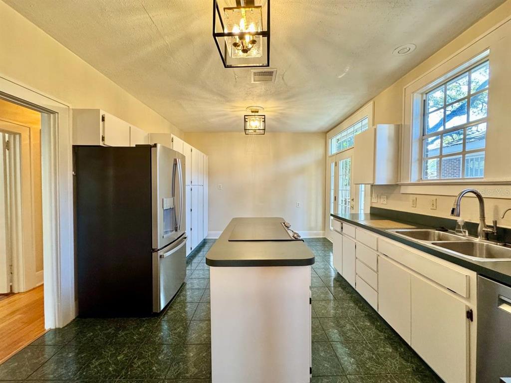 3112 West Palmira Avenue Tampa, FL 33629 - Photo 9 of 37 a kitchen with stainless steel appliances a refrigerator a sink a stove and a refrigerator