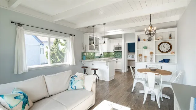 a living room with kitchen island furniture and a large window