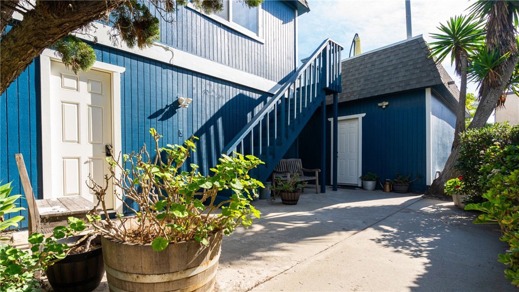 5510 Driftwood Street, Unit 4 Oxnard, CA 93035 - Photo 20 of 23 a front view of a house with a garden
