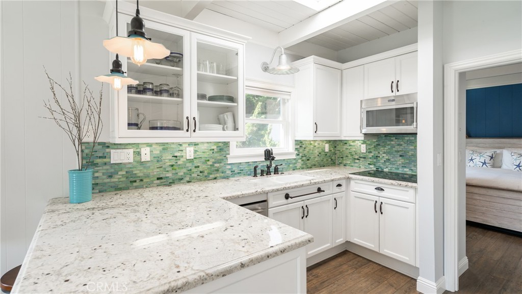 5510 Driftwood Street, Unit 4 Oxnard, CA 93035 - Photo 4 of 23 a kitchen with a sink and cabinets