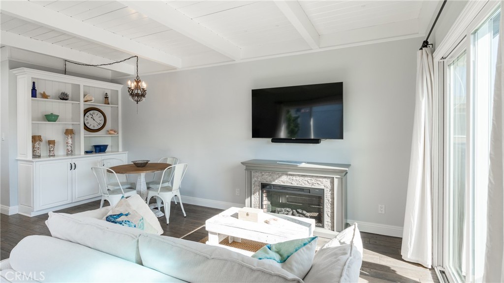 5510 Driftwood Street, Unit 4 Oxnard, CA 93035 - Photo 5 of 23 a living room with furniture a flat screen tv and a fireplace