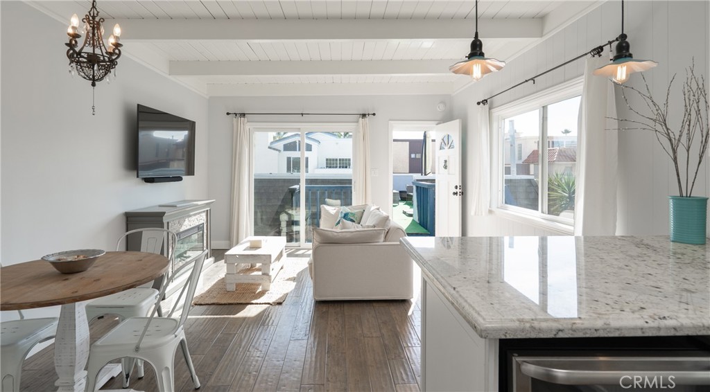 5510 Driftwood Street, Unit 4 Oxnard, CA 93035 - Photo 7 of 23 a living room with furniture a flat screen tv and a fireplace