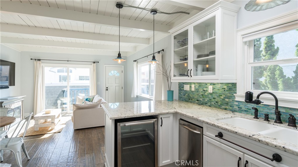 5510 Driftwood Street, Unit 4 Oxnard, CA 93035 - Photo 8 of 23 a kitchen with a sink stove and wooden floor