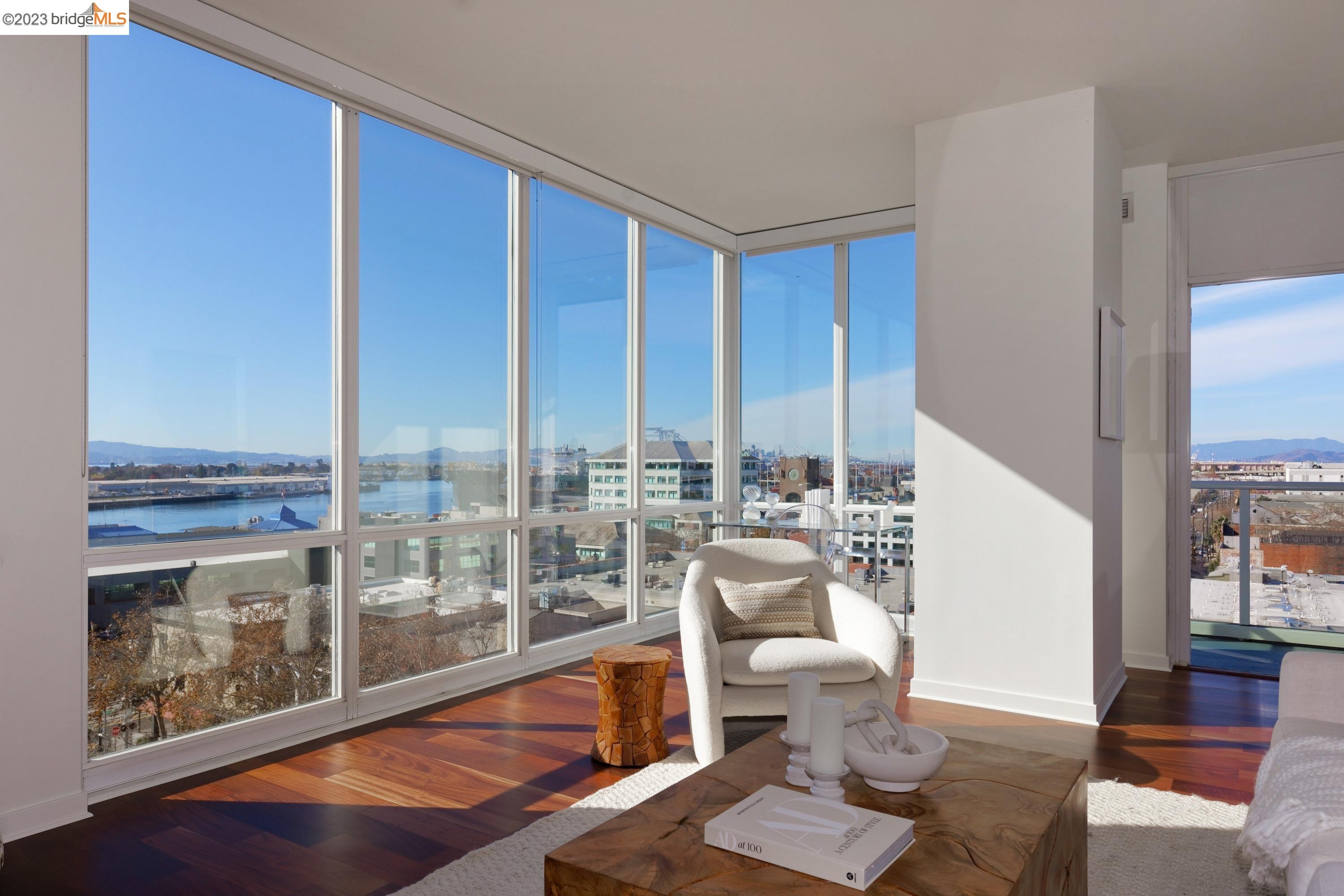 a room with furniture and a floor to ceiling window