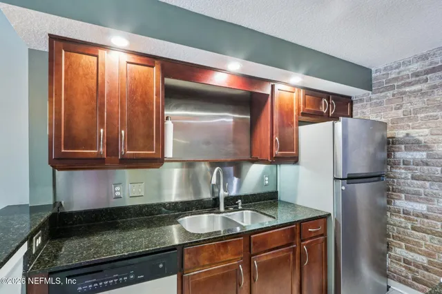 a kitchen with a stove and a microwave