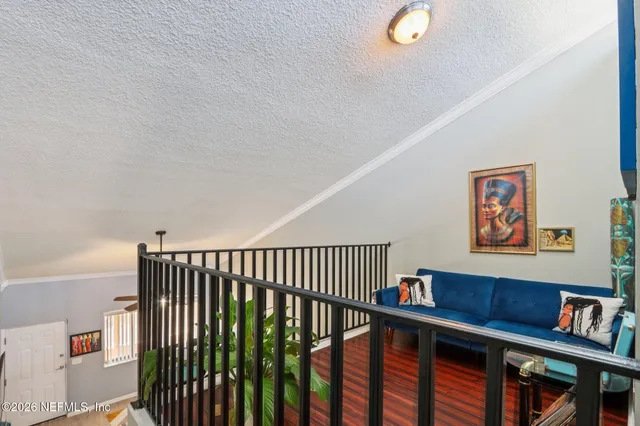 a bedroom with a bed and a mirror