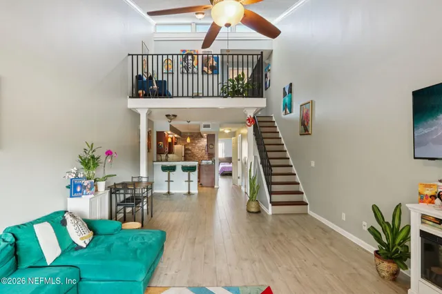 a view of an entryway with wooden floor