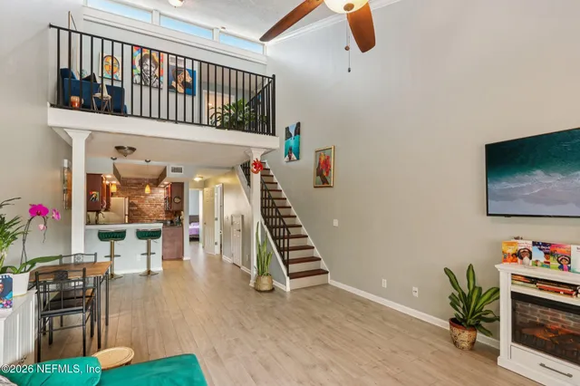 a kitchen with stainless steel appliances kitchen island granite countertop a refrigerator and a stove