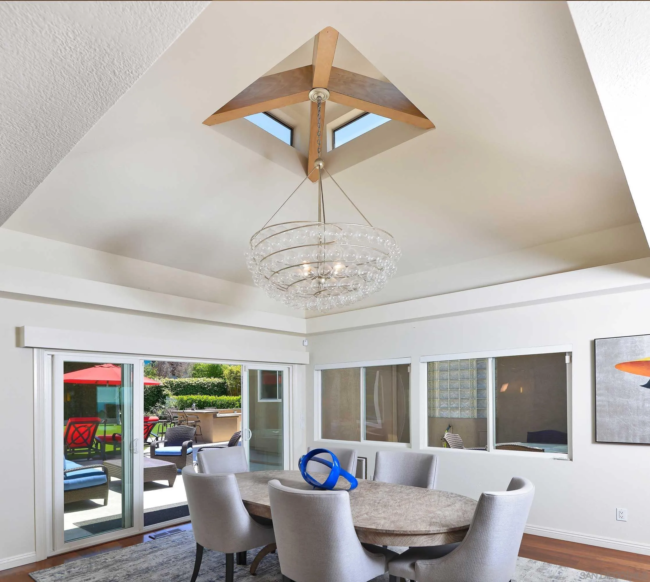 5459 Moonlight Lane La Jolla, CA 92037 - Photo 12 of 32 a living room with furniture and a chandelier