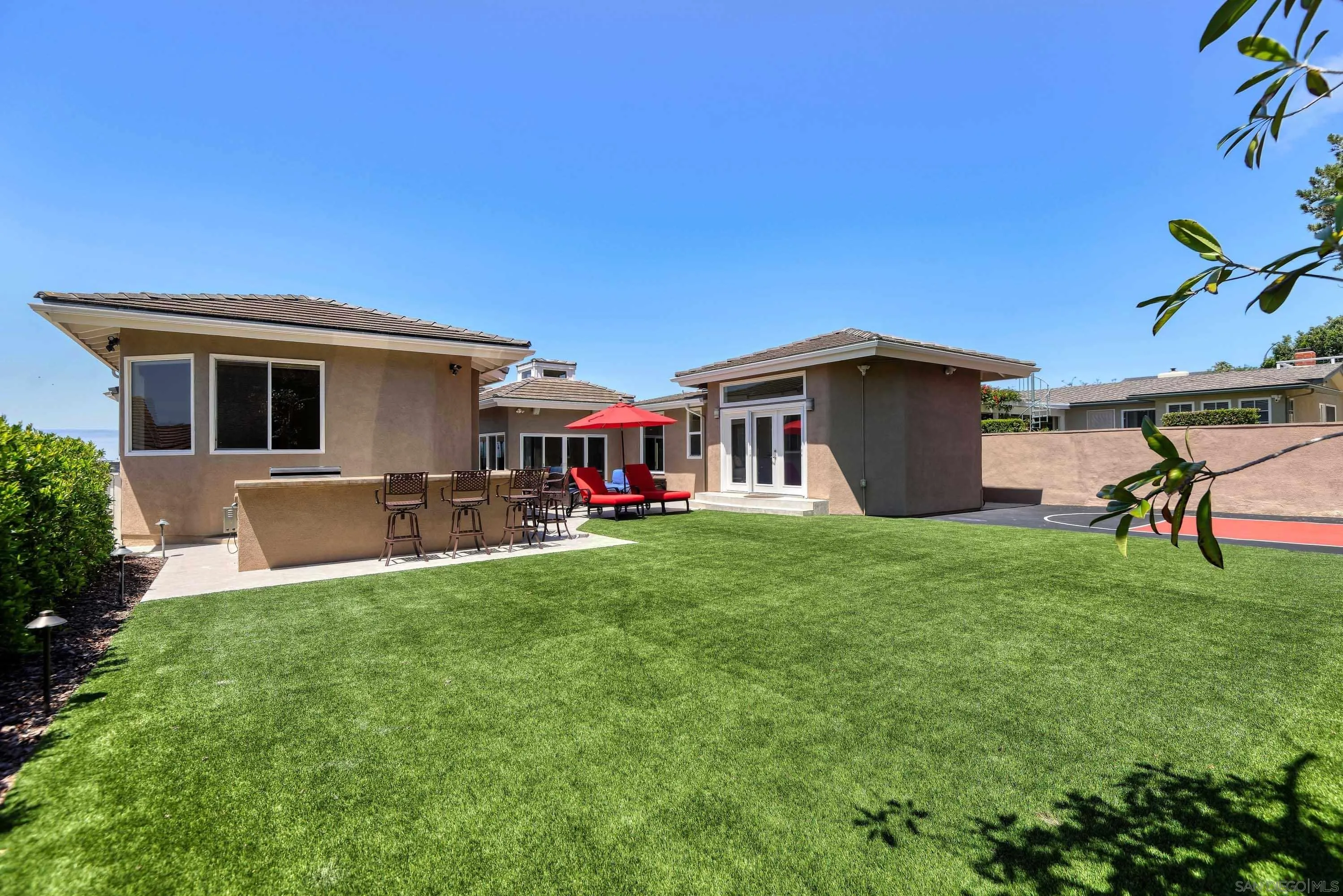 5459 Moonlight Lane La Jolla, CA 92037 - Photo 18 of 32 a view of a house with backyard and sitting area