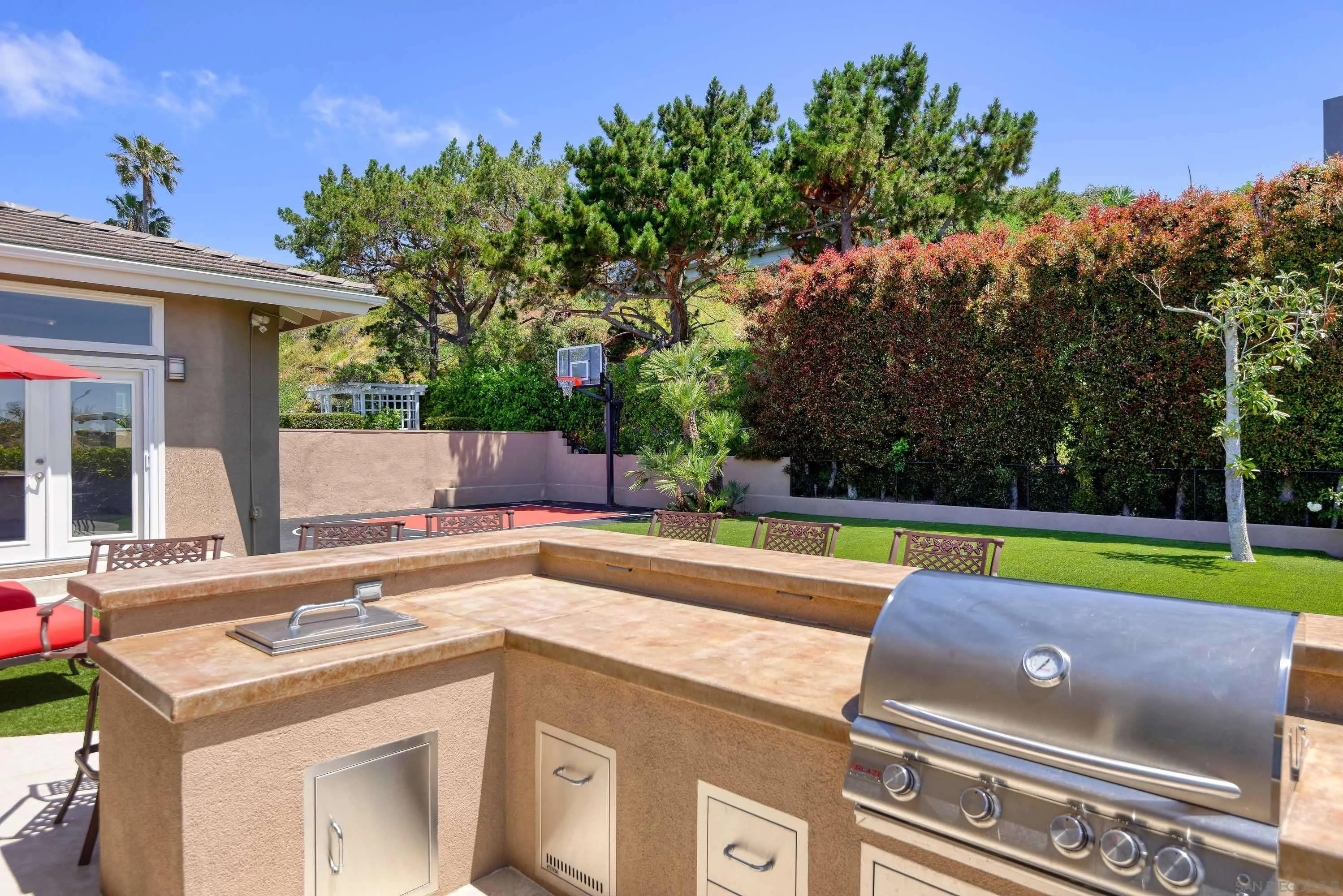 5459 Moonlight Lane La Jolla, CA 92037 - Photo 19 of 32 a view of a kitchen with a swimming pool and a yard