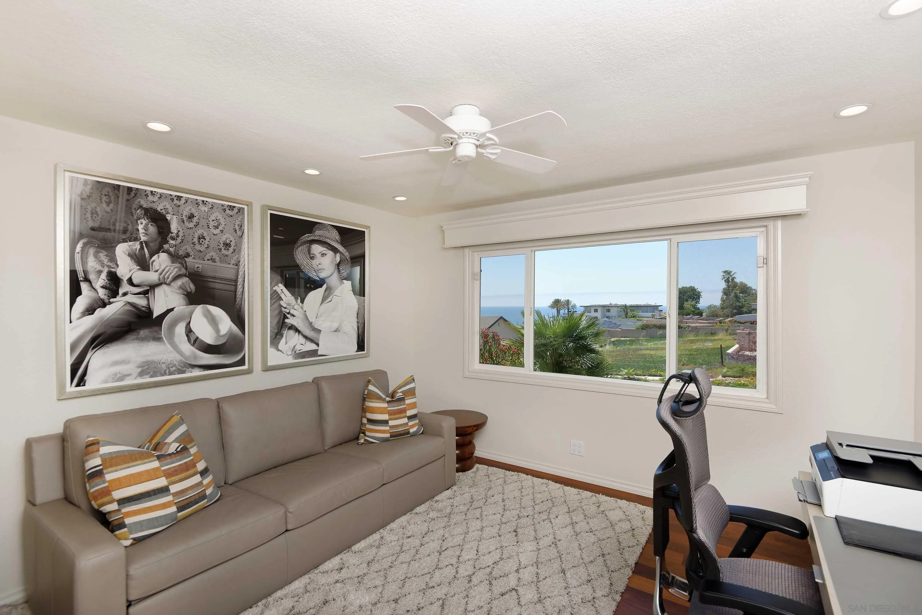 5459 Moonlight Lane La Jolla, CA 92037 - Photo 23 of 32 a living room with furniture and a large window