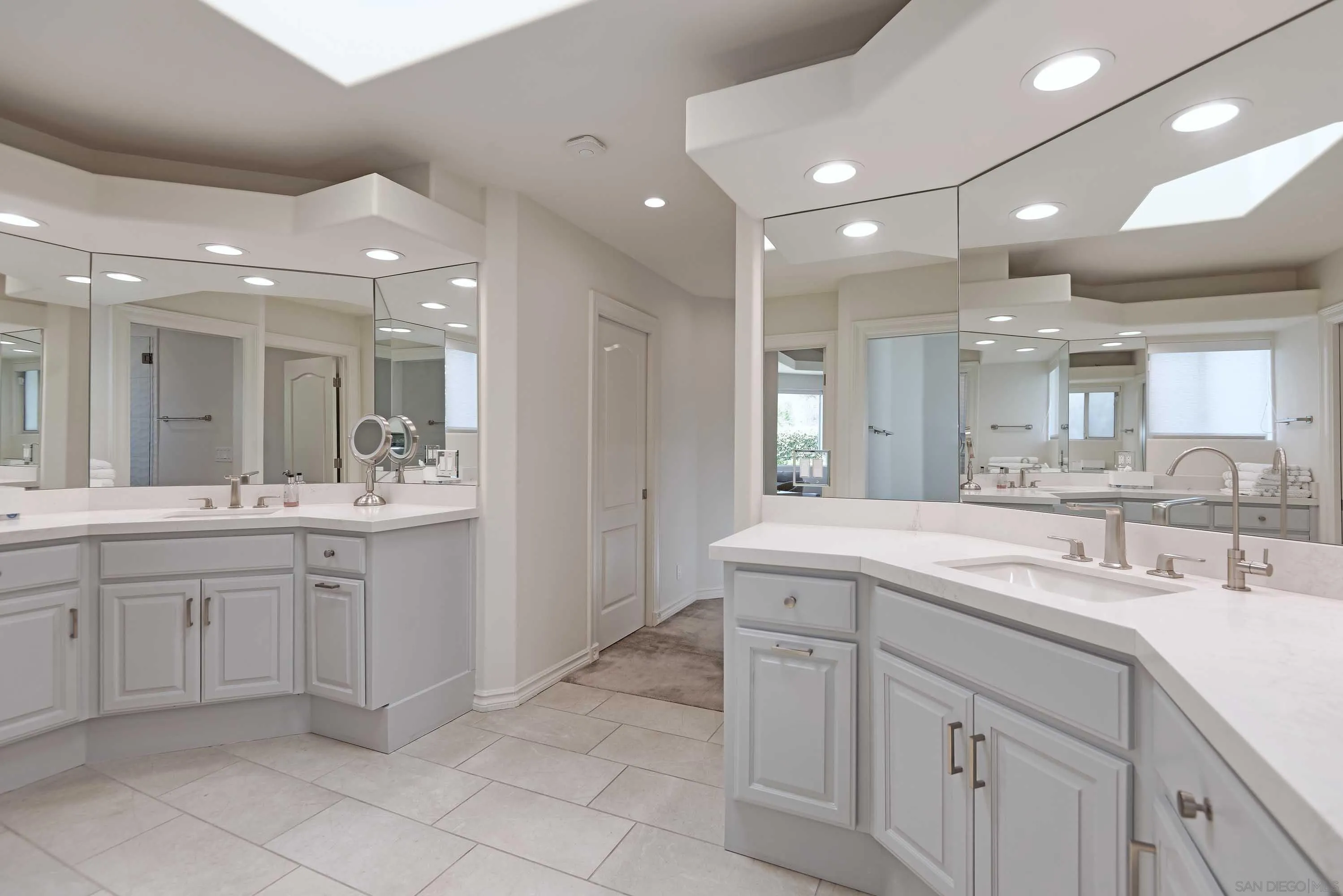 5459 Moonlight Lane La Jolla, CA 92037 - Photo 29 of 32 a bathroom with a sink vanity and mirror
