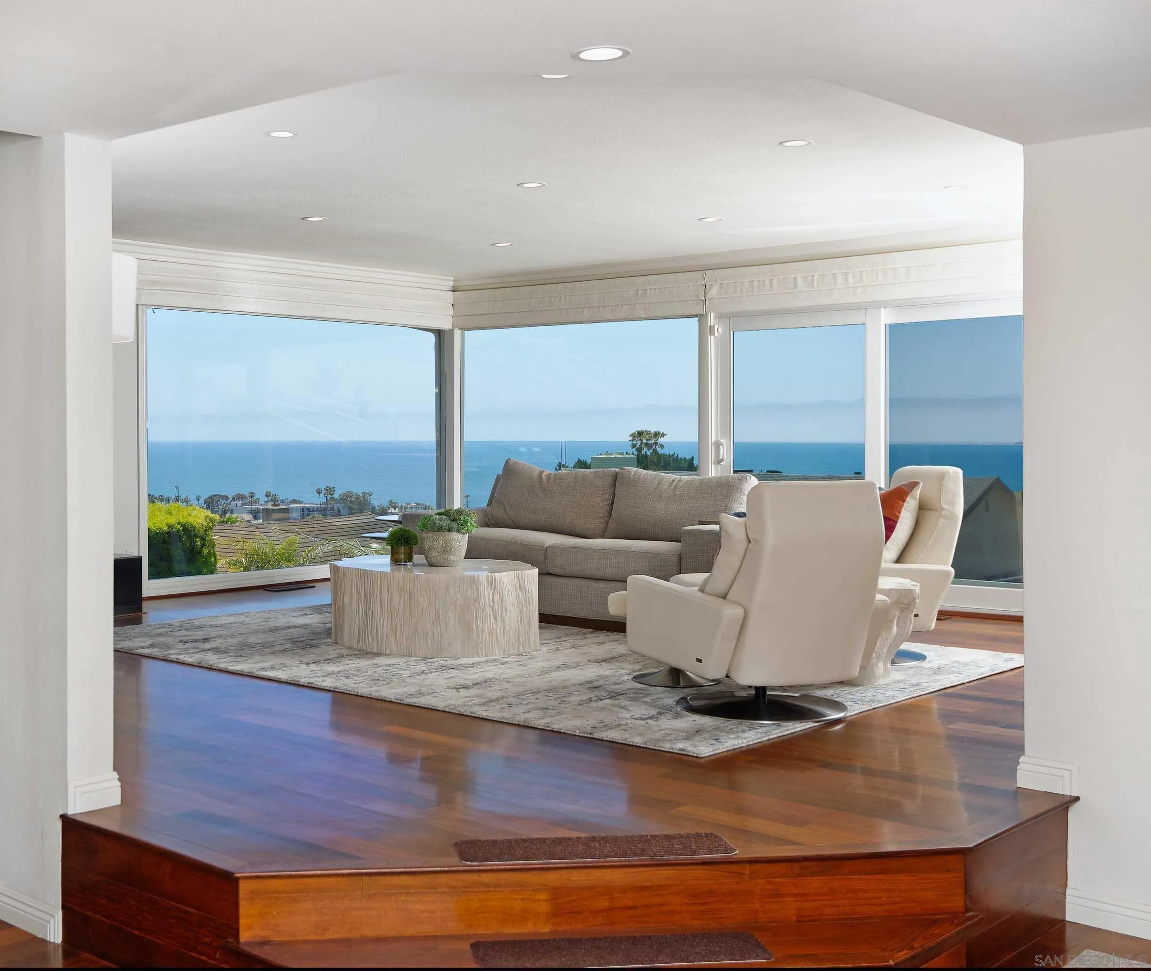 5459 Moonlight Lane La Jolla, CA 92037 - Photo 5 of 32 a living room with furniture and large windows