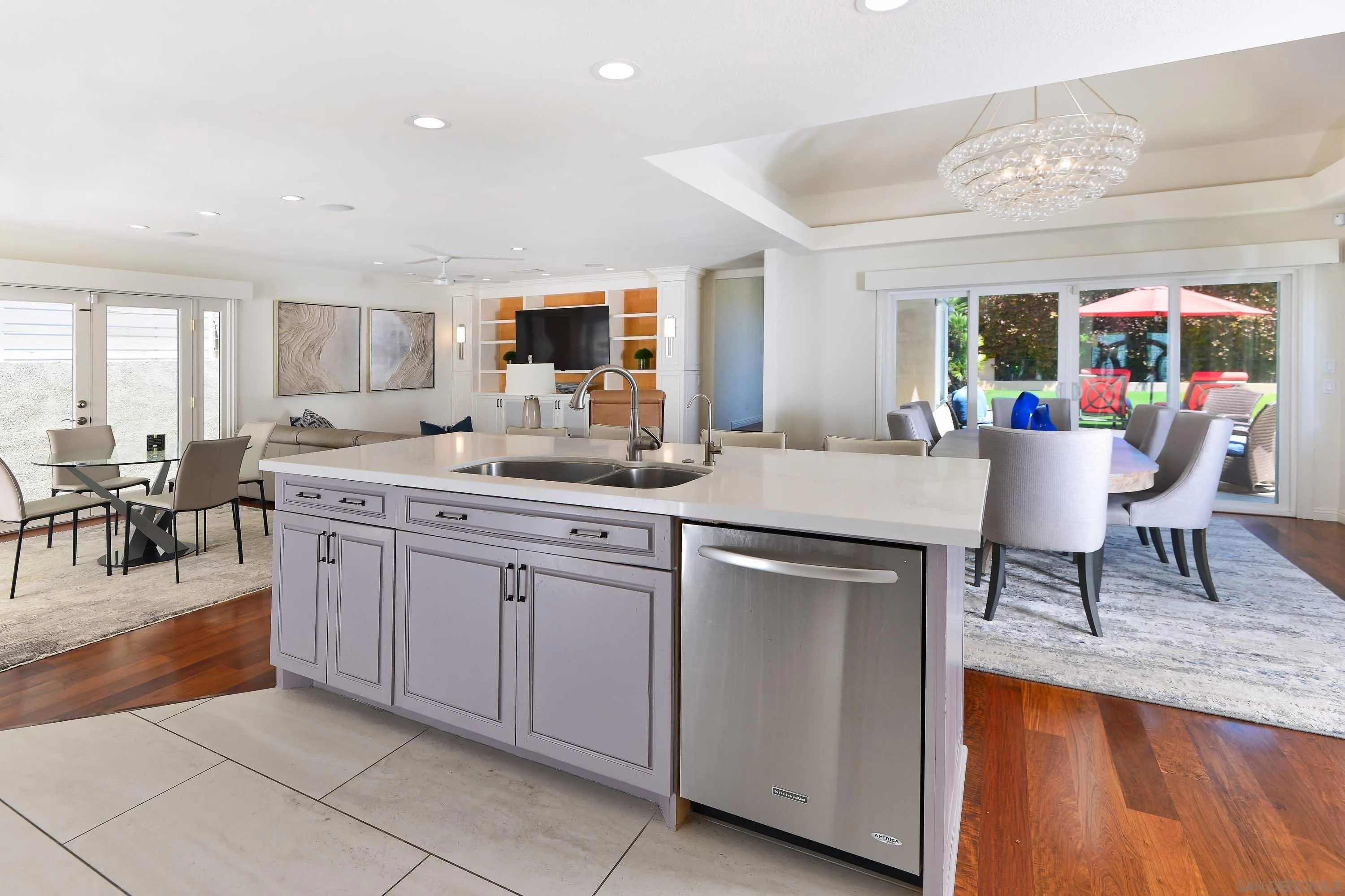 5459 Moonlight Lane La Jolla, CA 92037 - Photo 7 of 32 a kitchen with stainless steel appliances granite countertop a sink and a refrigerator