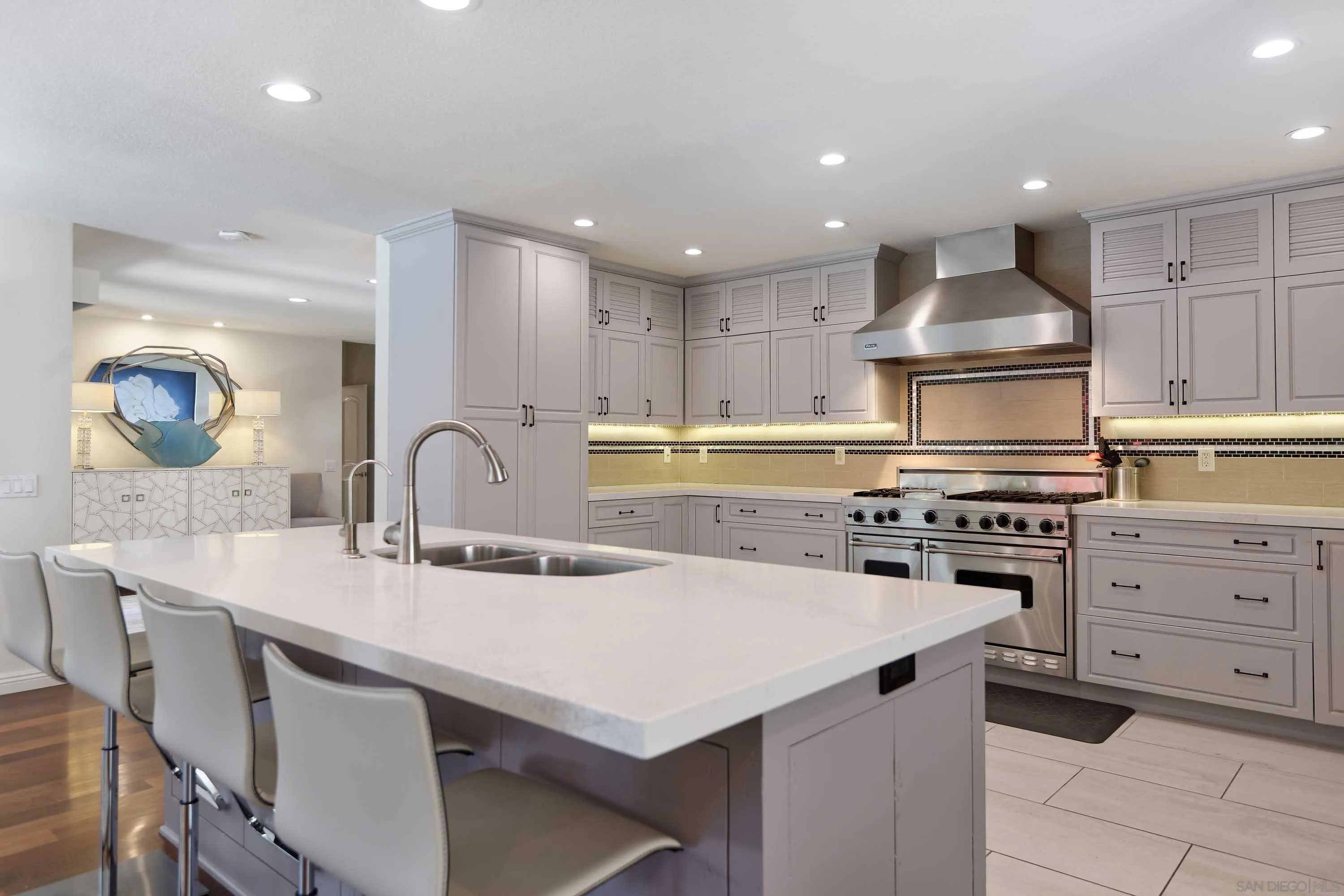 5459 Moonlight Lane La Jolla, CA 92037 - Photo 10 of 32 a kitchen with a sink stainless steel appliances and cabinets