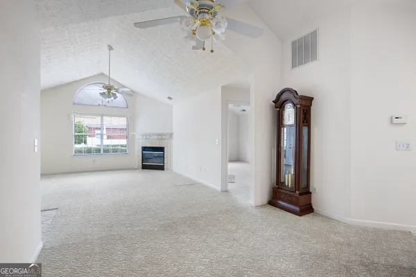 a dining room with furniture and a chandelier