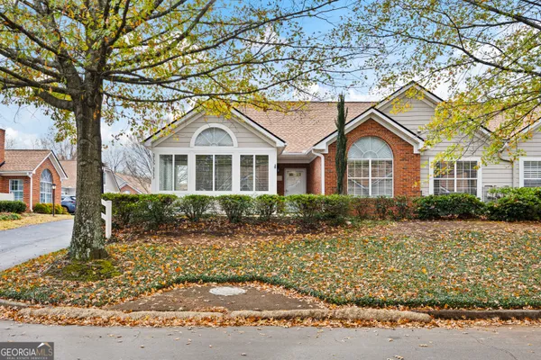 a front view of a house with a yard