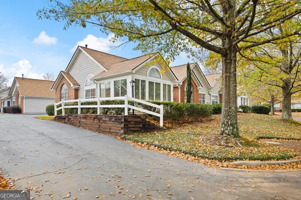 a view of a backyard with sitting area