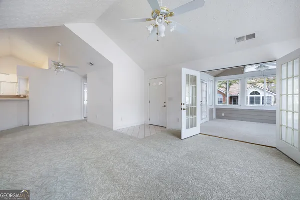 a view of an empty room with a window