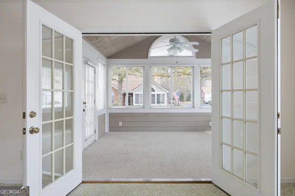 a view of an empty room with a window