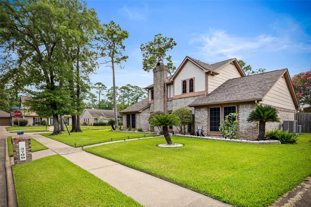 a front view of a house with a yard table and chairs