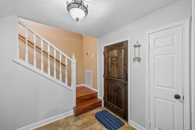 a view of entryway with wooden floor