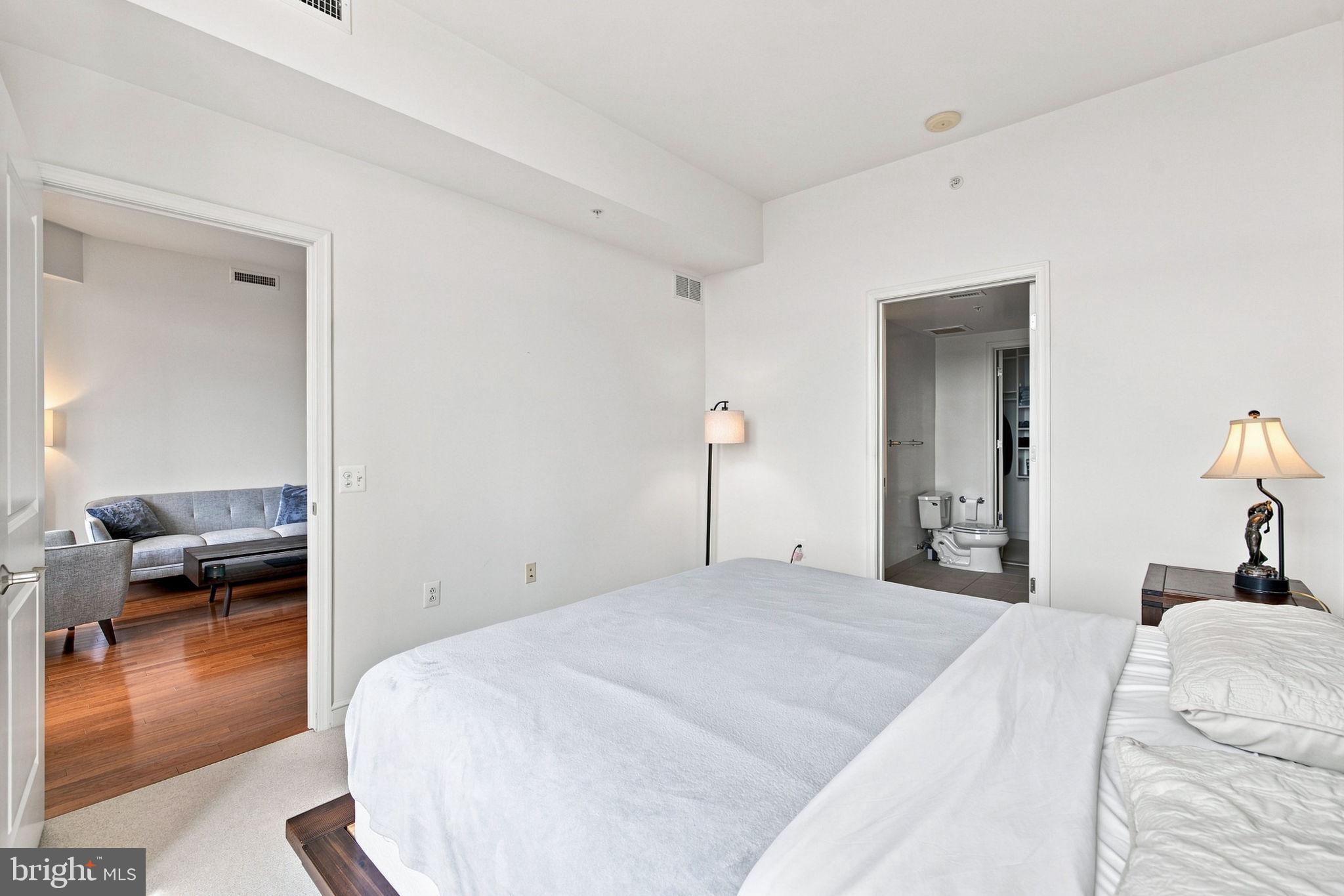 11990 Market Street, Unit 1514 Reston, VA 20190 - Photo 27 of 78 Primary bedroom with attached bathroom