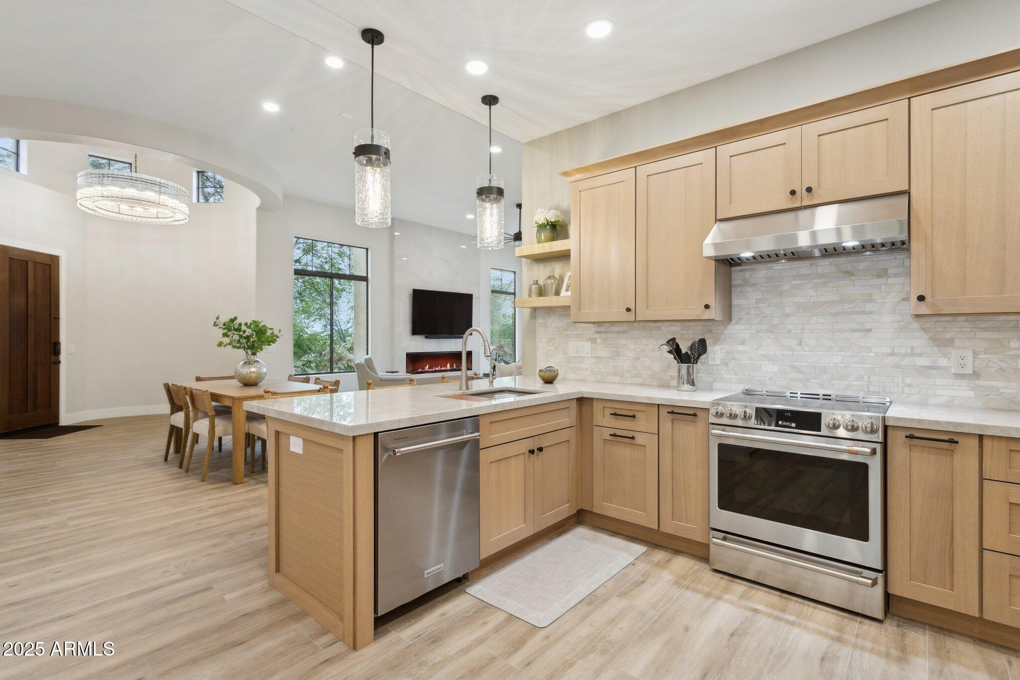 9270 East Thompson Peak Parkway, Unit 364 Scottsdale, AZ 85255 - Photo 13 of 45 a kitchen with white cabinets and white appliances